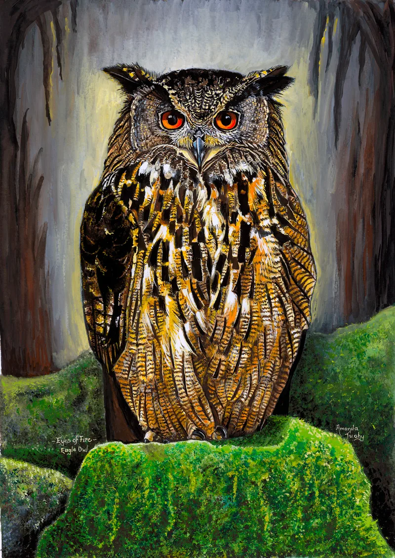 An eagle owl with fiery orange eyes and tall ear tufts stands upright on a moss-covered stump, in front of dark tree trunks.