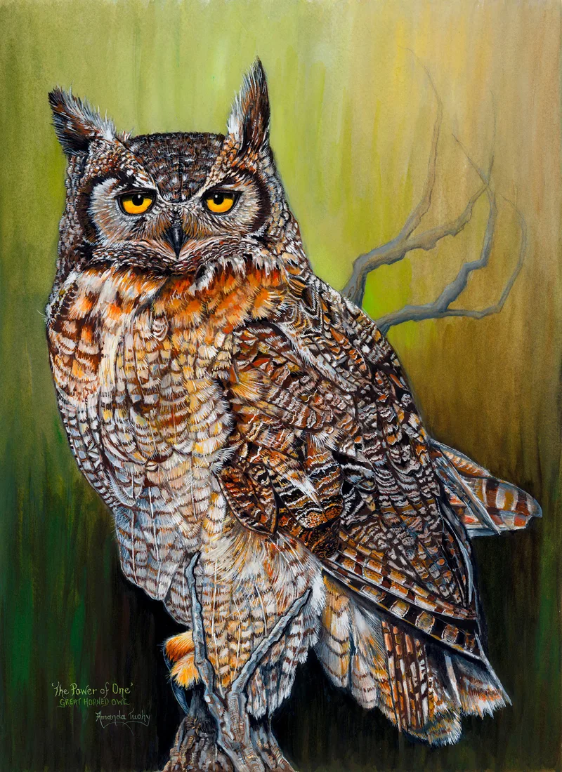 A great horned owl with orange-yellow eyes and tall ear tufts perches on a stump and looks straight out of the picture, against a soft olive green and gold background.